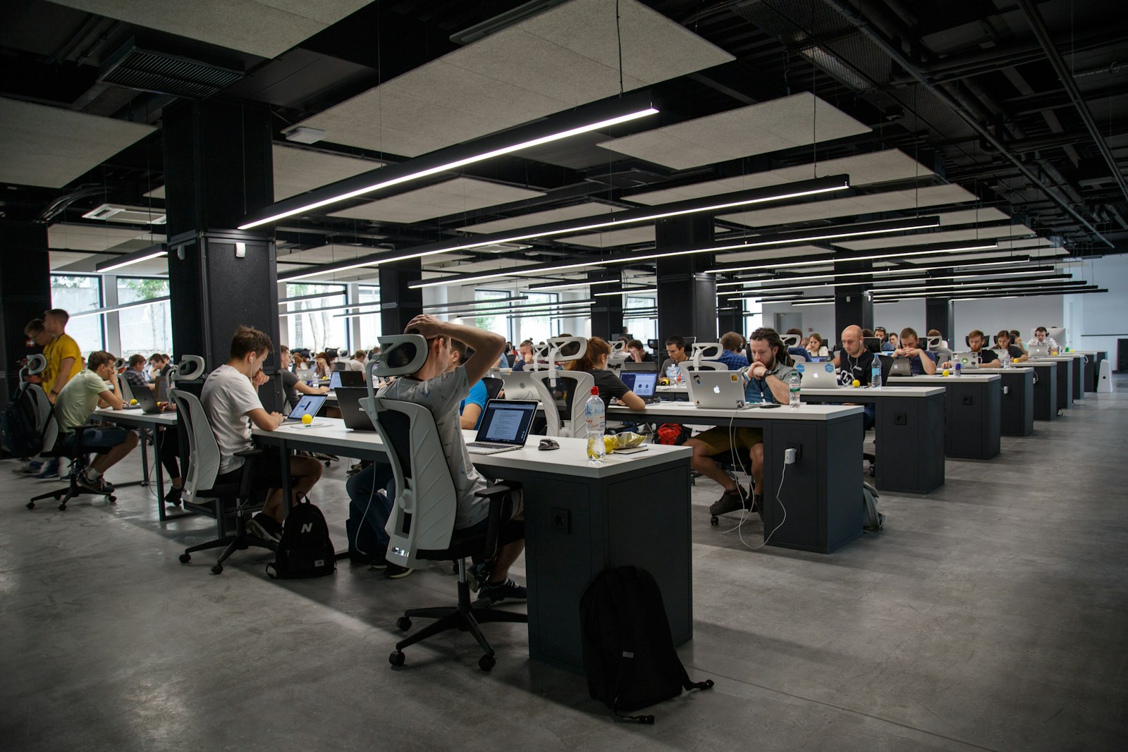 Compliance officers reviewing cloud contracts at a live business desk